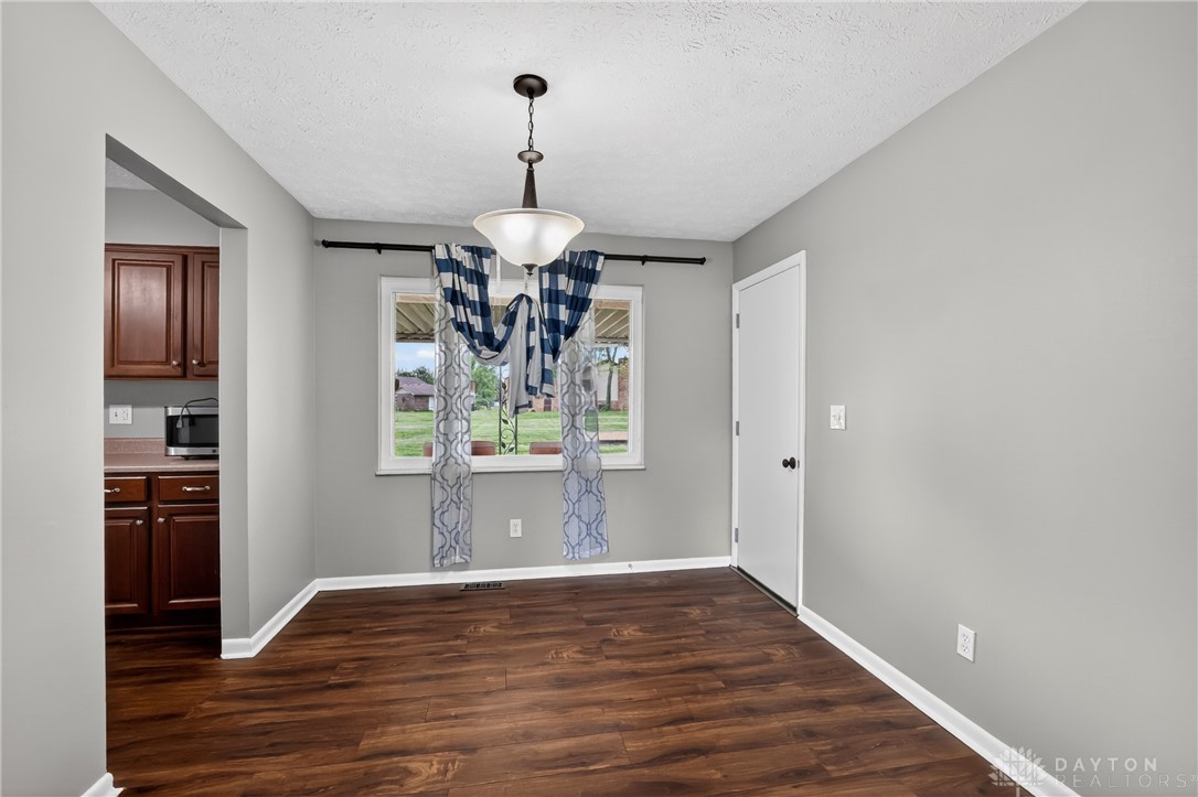 5741 Gray Road Fairfield, OH 45014 - Photo 7 of 32 This inviting dining area features warm flooring and a pleasant view.