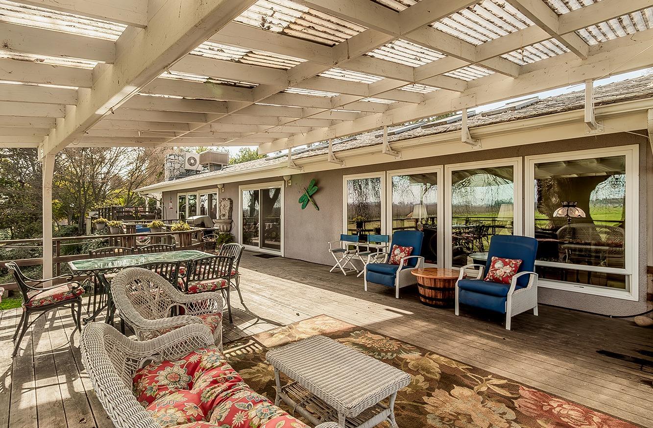 3670 South Newmark Avenue Sanger, CA 93657 - Photo 18 of 98 a view of a patio with table and chairs and potted plants