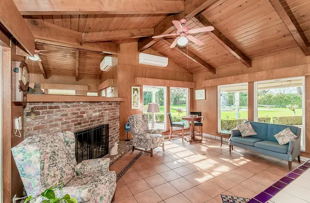 a view of swimming pool with outdoor seating and trees