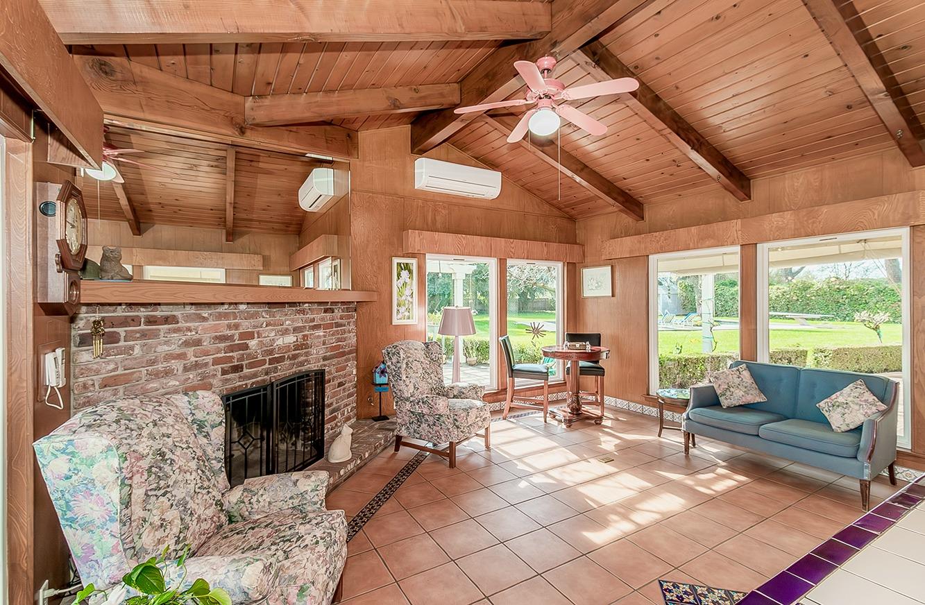 3670 South Newmark Avenue Sanger, CA 93657 - Photo 25 of 98 a living room with furniture and a fireplace