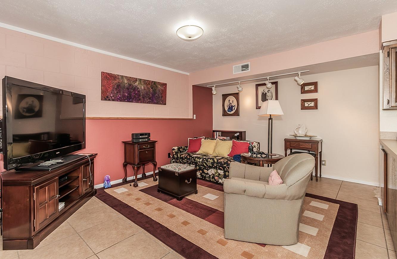 3670 South Newmark Avenue Sanger, CA 93657 - Photo 37 of 98 a living room with furniture and a flat screen tv