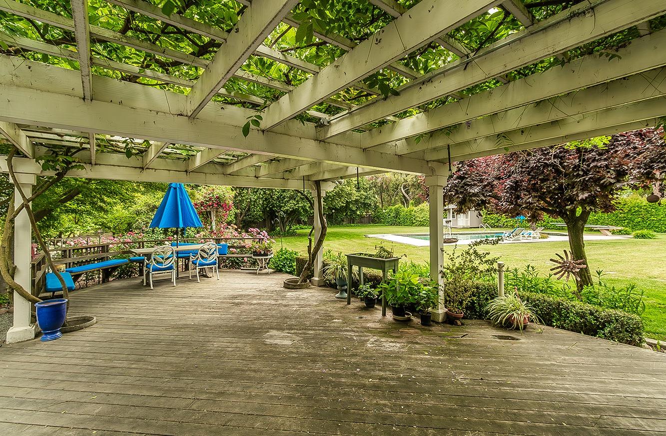 3670 South Newmark Avenue Sanger, CA 93657 - Photo 48 of 98 a view of a patio with table and chairs potted plants and large tree