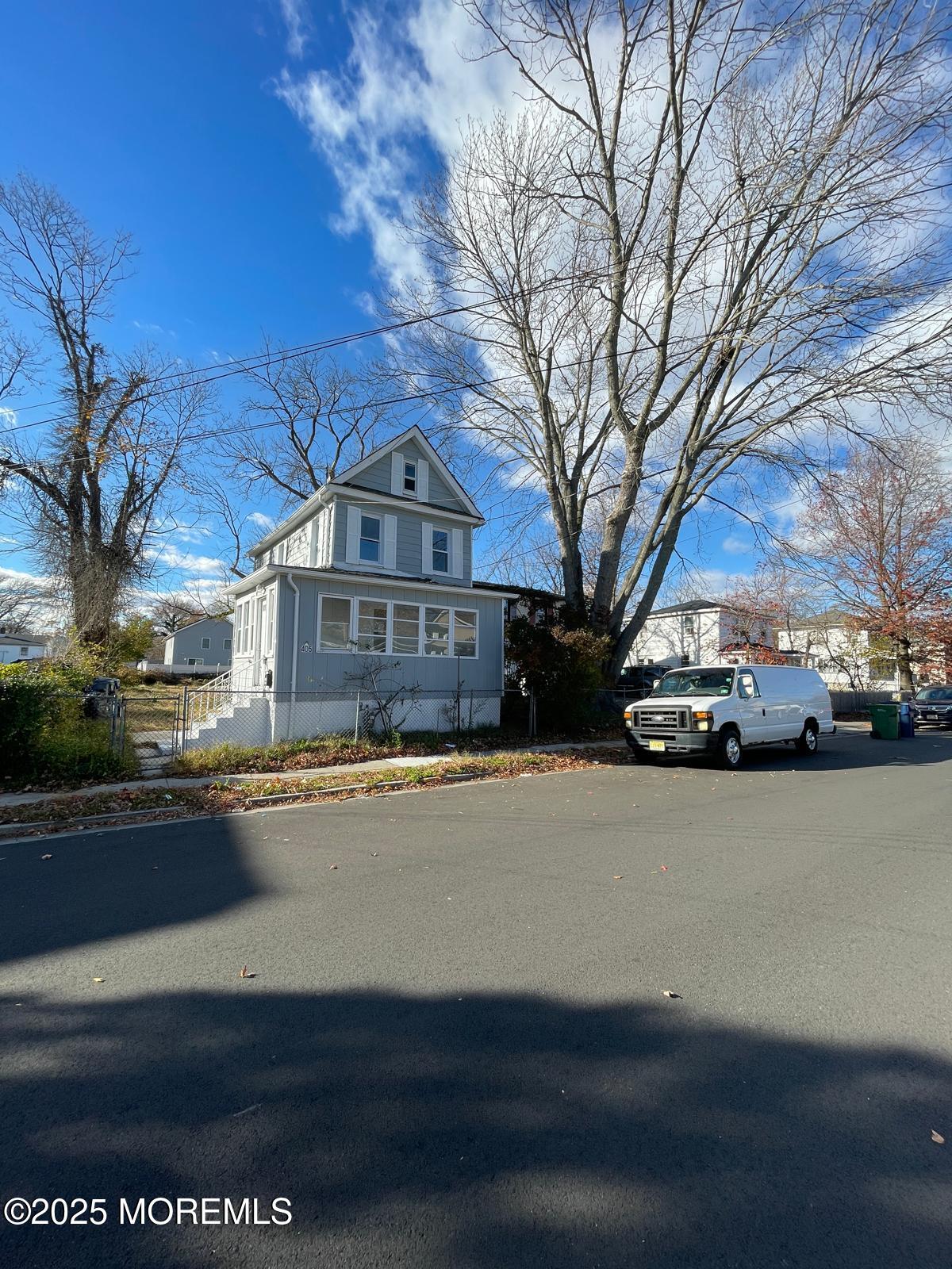 405 Myrtle Avenue Neptune Township, NJ 07753 - Photo 19 of 20 a front view of a house with a yard