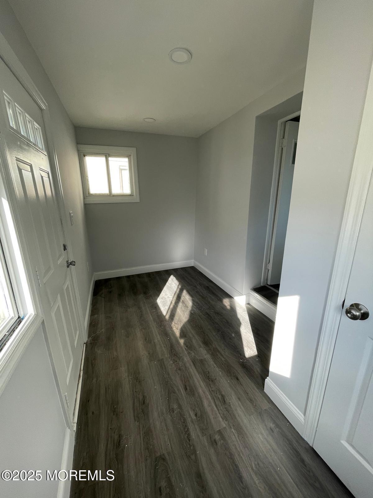 405 Myrtle Avenue Neptune Township, NJ 07753 - Photo 5 of 20 a view of an empty room and wooden floor