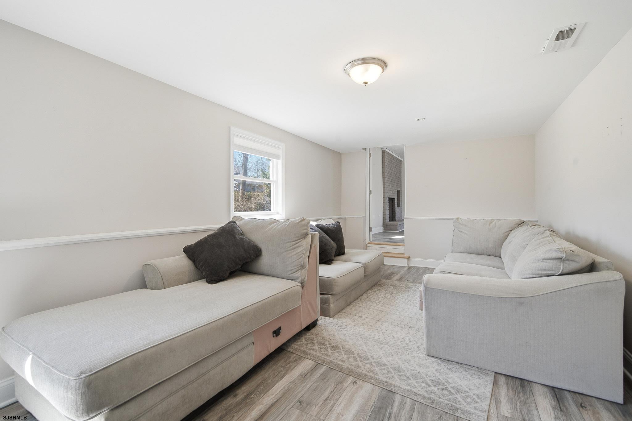 1103 Chelsea Road Absecon, NJ 08201 - Photo 13 of 34 a living room with furniture and a couch