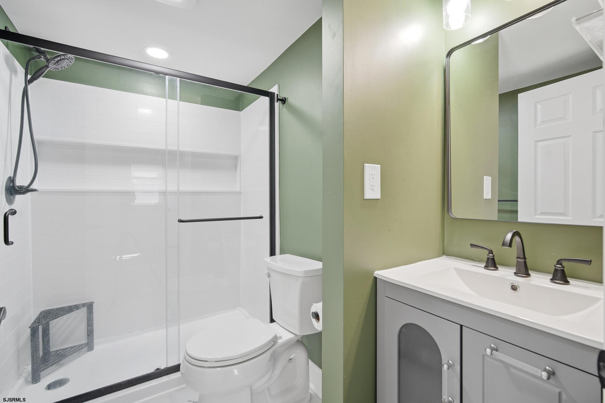 1103 Chelsea Road Absecon, NJ 08201 - Photo 19 of 34 a bathroom with a granite countertop sink toilet and shower
