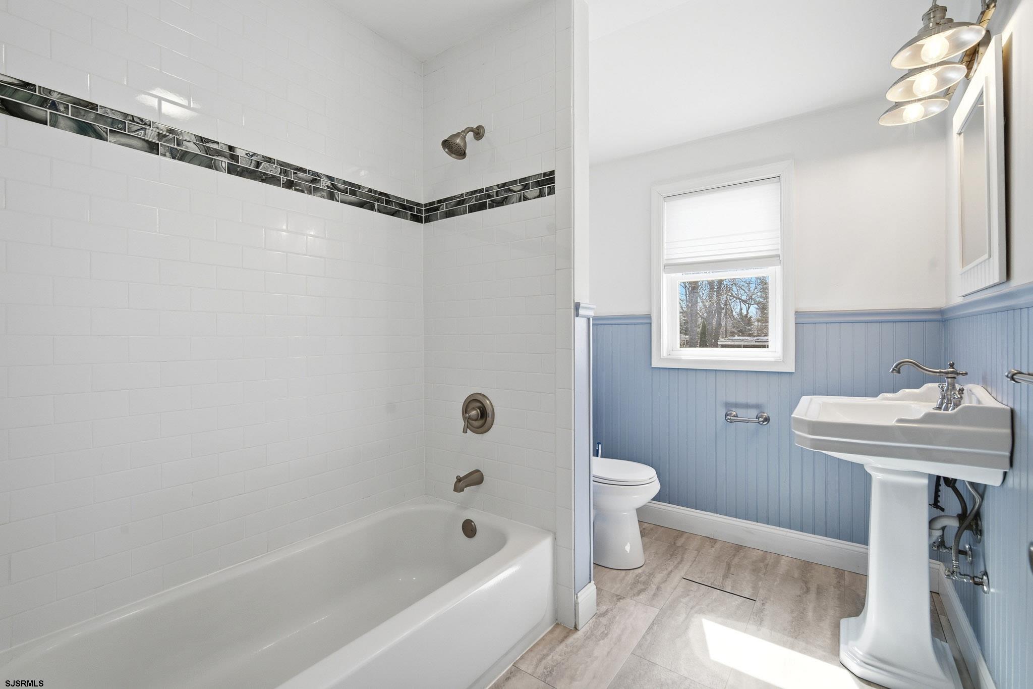 1103 Chelsea Road Absecon, NJ 08201 - Photo 23 of 34 a bathroom with a sink a toilet and shower