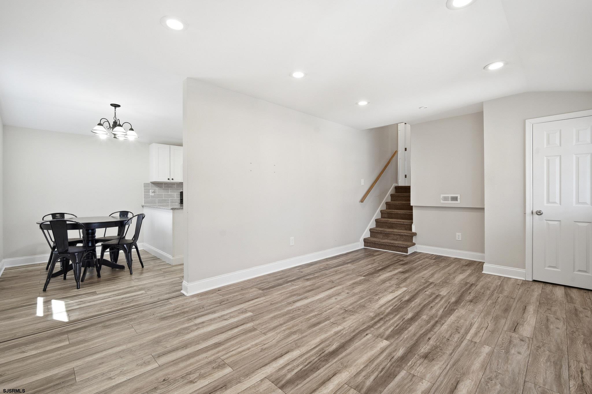 1103 Chelsea Road Absecon, NJ 08201 - Photo 8 of 34 wooden floor in an empty room with a window