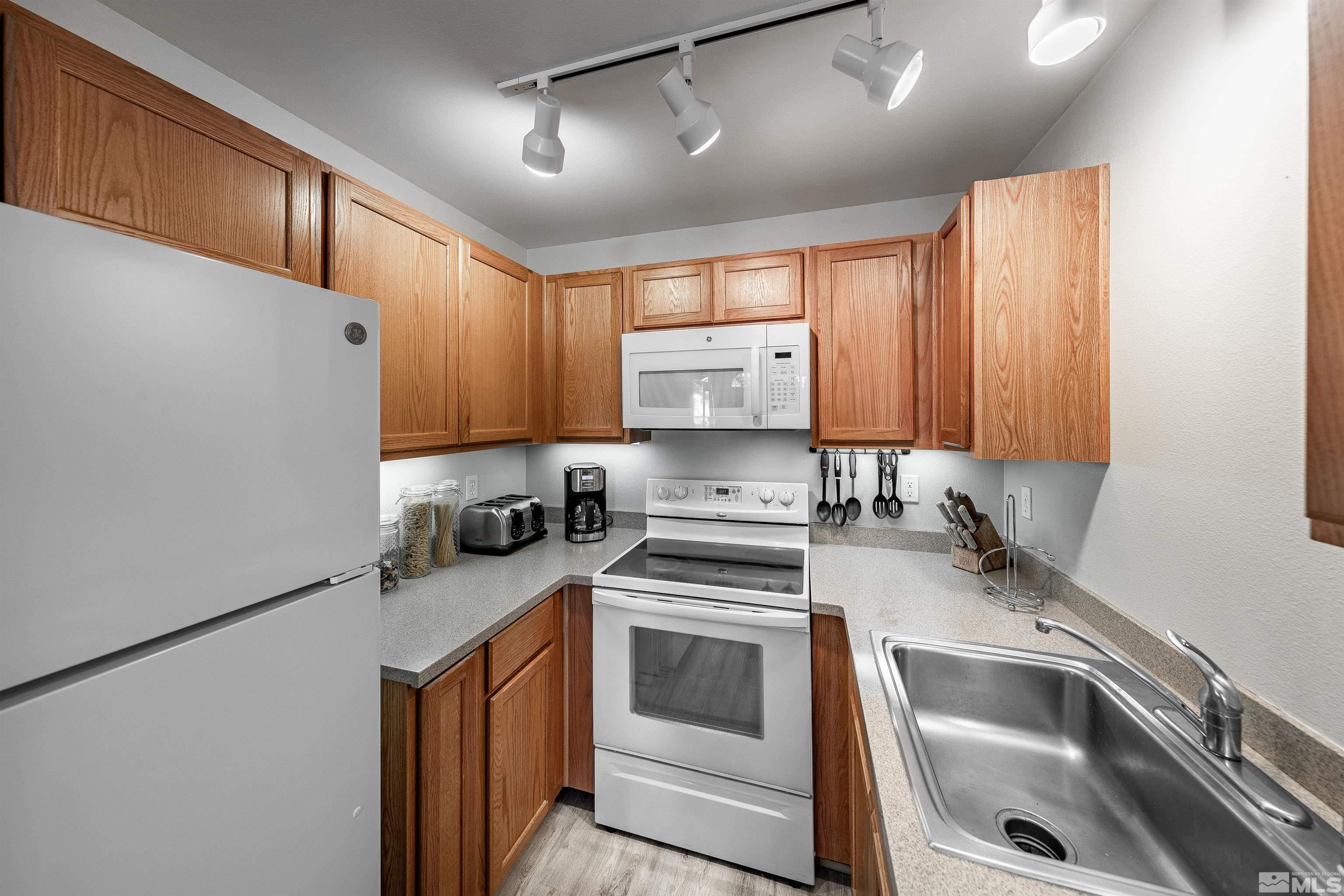 360 Galaxy Lane, Unit 2 (B) Stateline, NV 89449 - Photo 5 of 22 a kitchen with a sink cabinets and stainless steel appliances