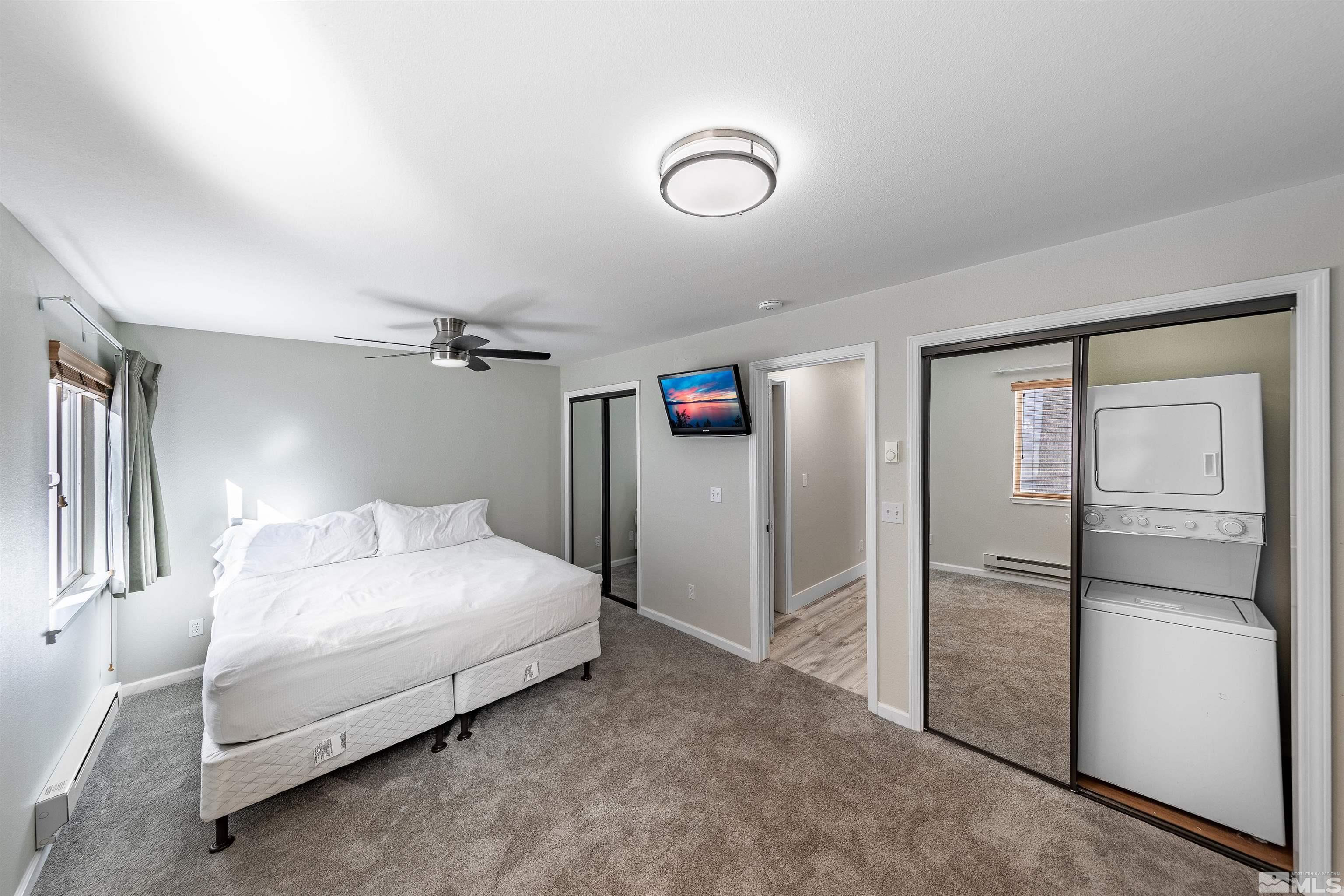 360 Galaxy Lane, Unit 2 (B) Stateline, NV 89449 - Photo 7 of 22 a bedroom with a bed and a refrigerator