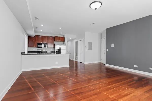 a view of kitchen appliances and cabinets
