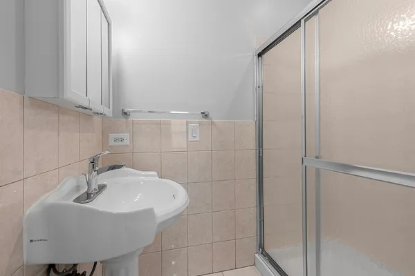 a bathroom with a sink and mirror