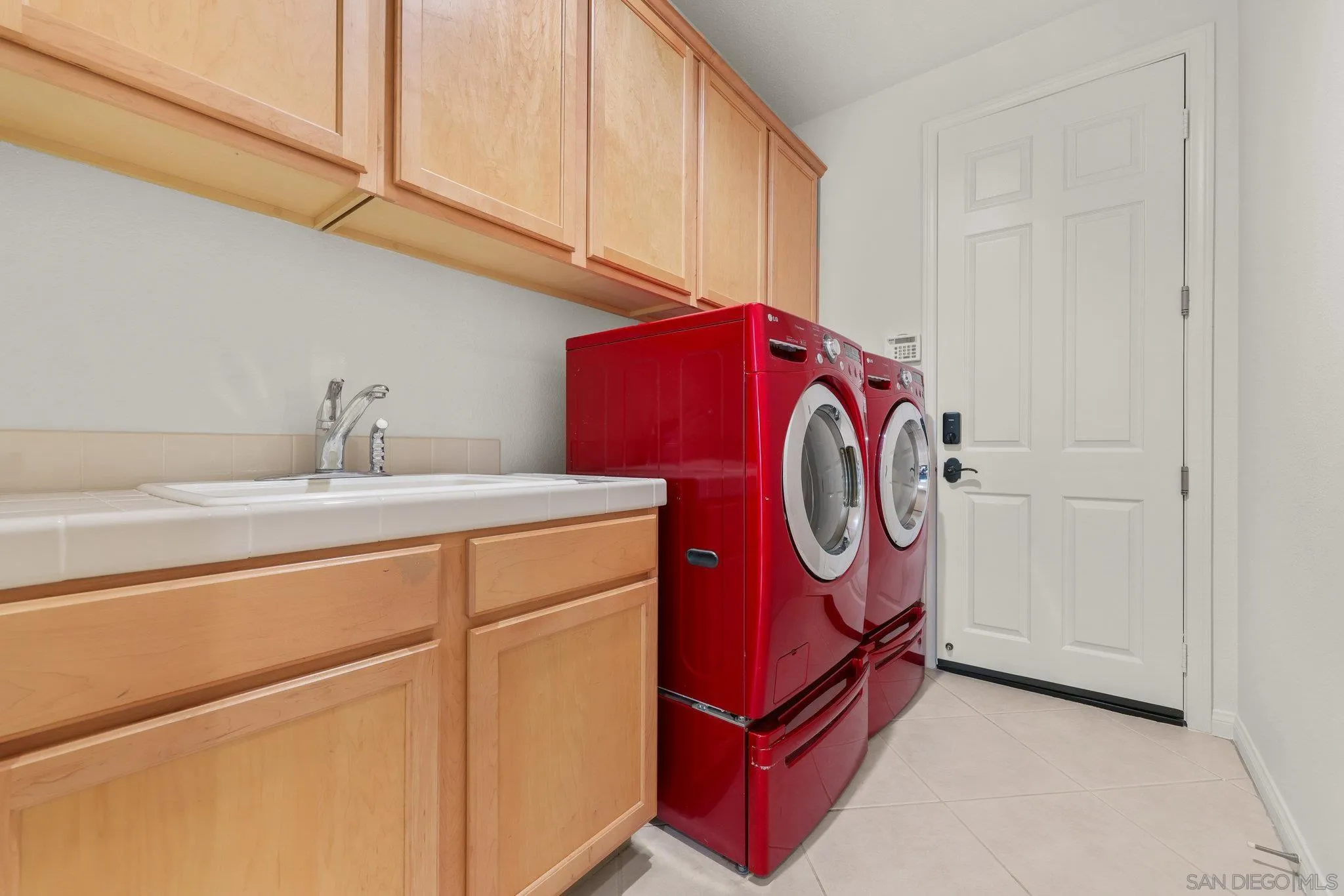 824 Hillcrest Terrace Fallbrook, CA 92028 - Photo 17 of 47 a utility room with dryer and washer