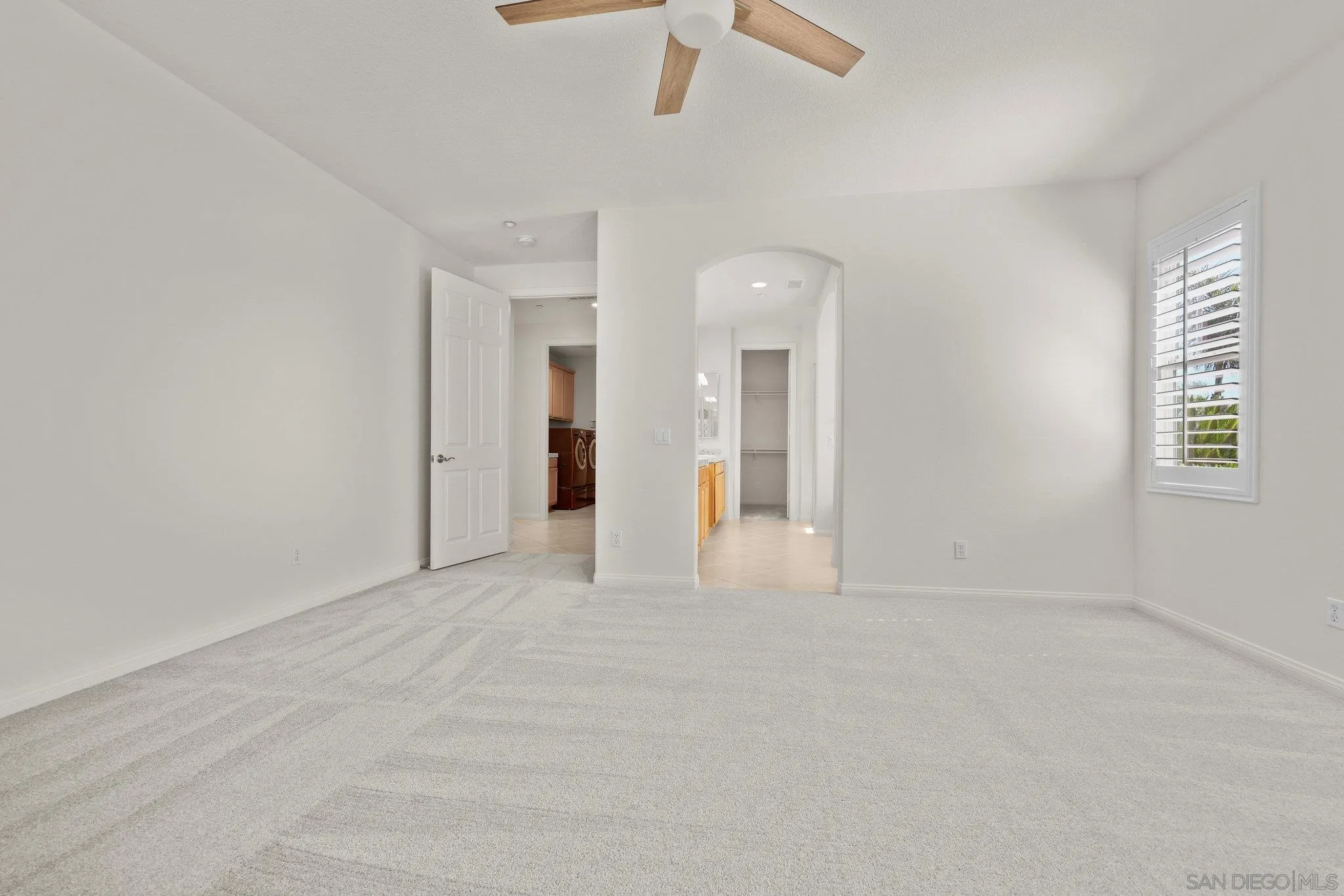 824 Hillcrest Terrace Fallbrook, CA 92028 - Photo 19 of 47 an empty room with windows and fan