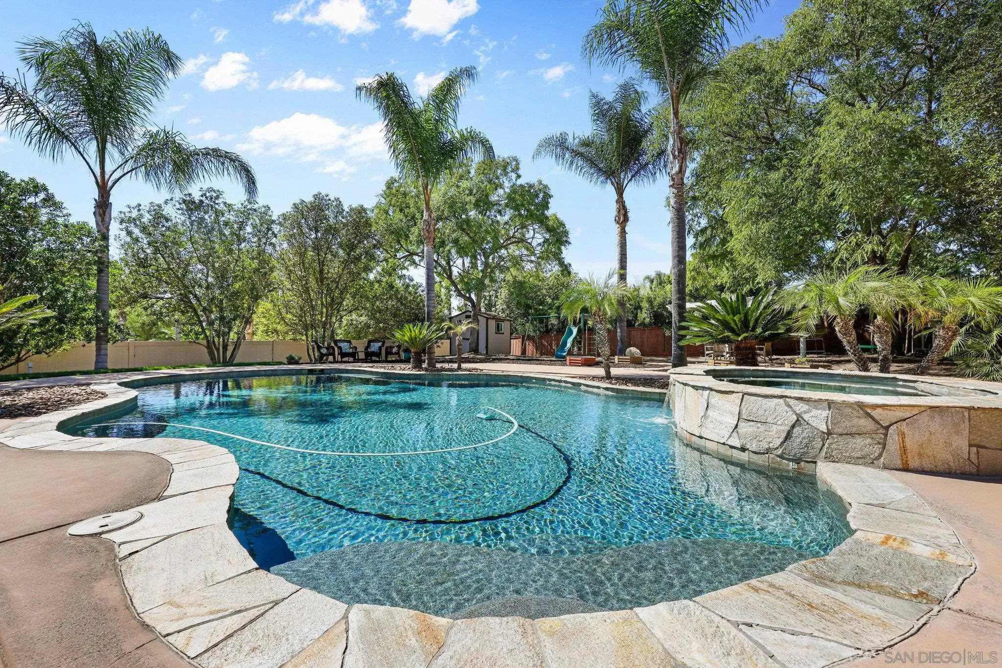 824 Hillcrest Terrace Fallbrook, CA 92028 - Photo 38 of 47 a view of a swimming pool with a patio