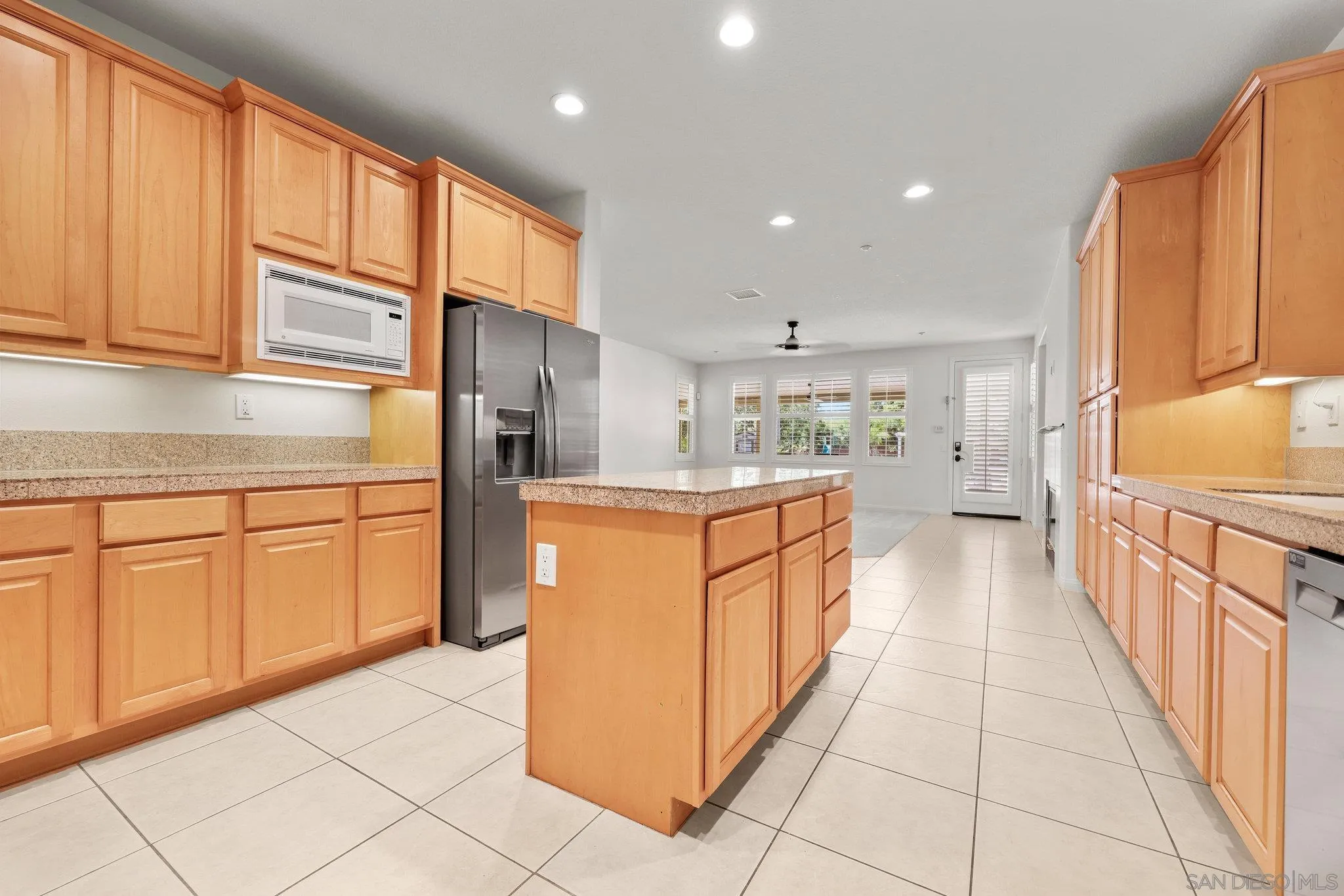 824 Hillcrest Terrace Fallbrook, CA 92028 - Photo 10 of 47 a kitchen with stainless steel appliances granite countertop a stove a sink and a refrigerator