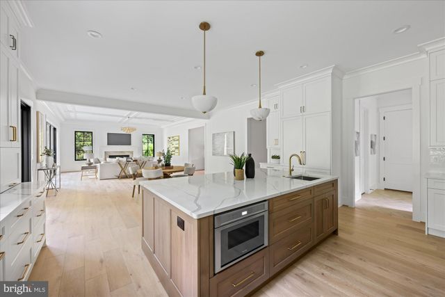 a kitchen with a sink and large window
