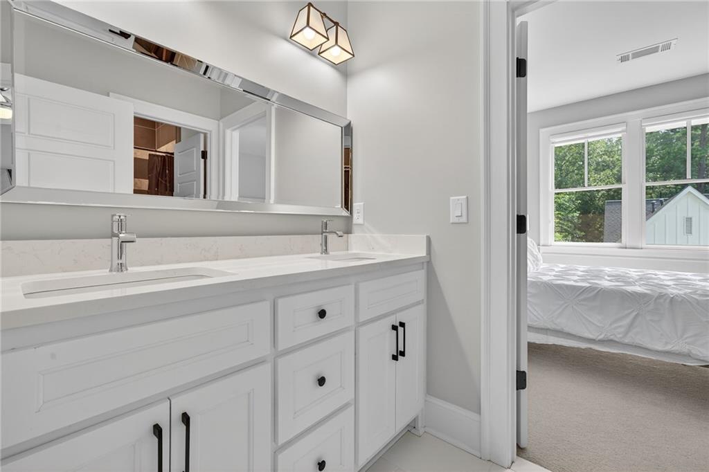 3110 Skyland Drive Northeast Chamblee, GA 30341 - Photo 22 of 43 a bathroom with a sink and a mirror