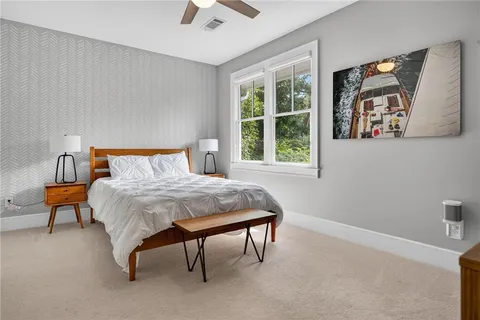 a bedroom with a bed and window
