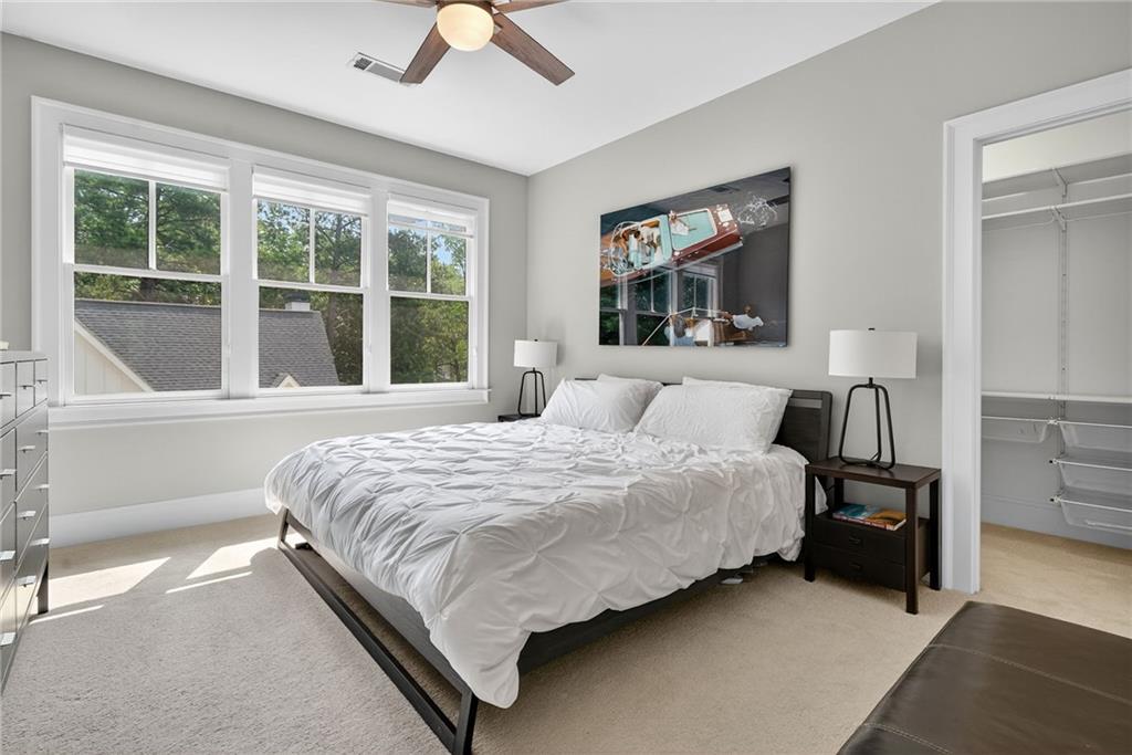 3110 Skyland Drive Northeast Chamblee, GA 30341 - Photo 26 of 43 a bedroom with bed and large window