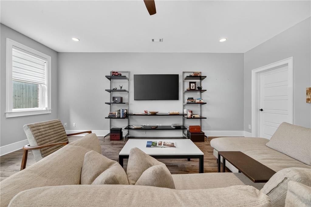 3110 Skyland Drive Northeast Chamblee, GA 30341 - Photo 28 of 43 a living room with furniture and a flat screen tv