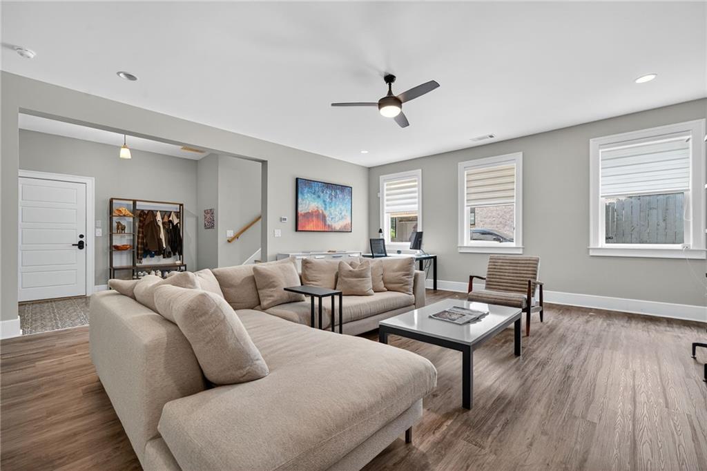 3110 Skyland Drive Northeast Chamblee, GA 30341 - Photo 29 of 43 a living room with furniture and a wooden floor