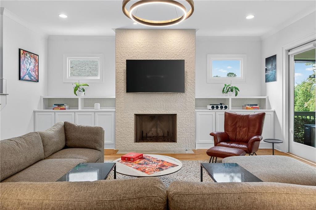 3110 Skyland Drive Northeast Chamblee, GA 30341 - Photo 4 of 43 a living room with furniture and a fireplace