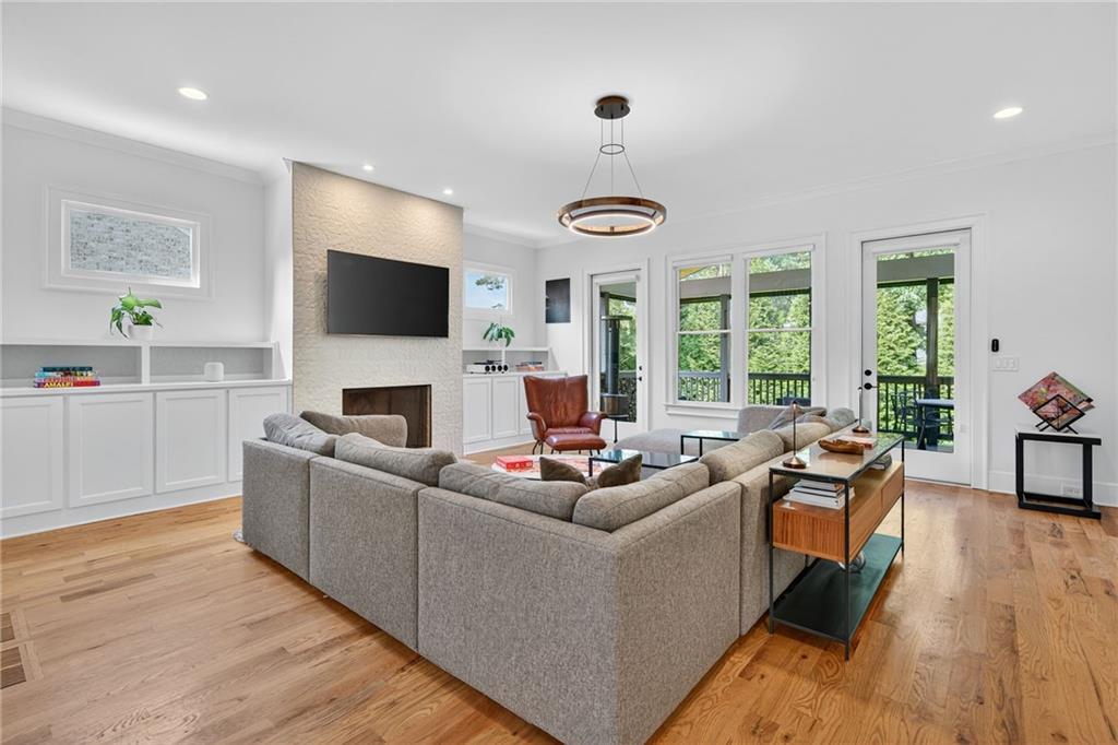 3110 Skyland Drive Northeast Chamblee, GA 30341 - Photo 5 of 43 a living room with fireplace furniture and a flat screen tv