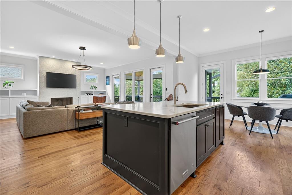 3110 Skyland Drive Northeast Chamblee, GA 30341 - Photo 8 of 43 a large kitchen with kitchen island granite countertop a large center island attached withe living room