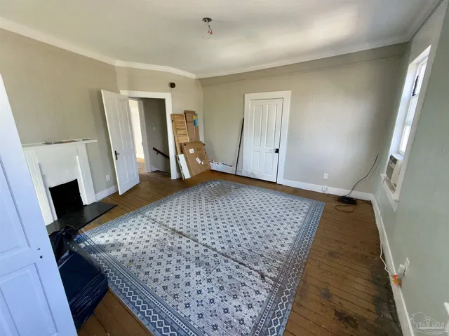 a view of livingroom with hardwood floor and a fireplace