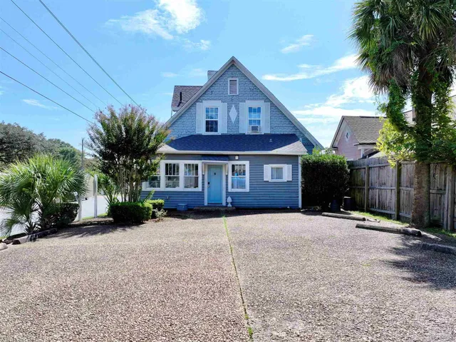 a front view of a house with yard