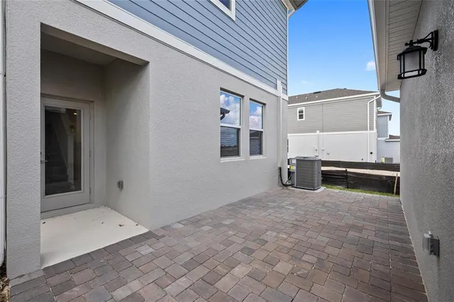 a view of a livingroom with entryway and staircase