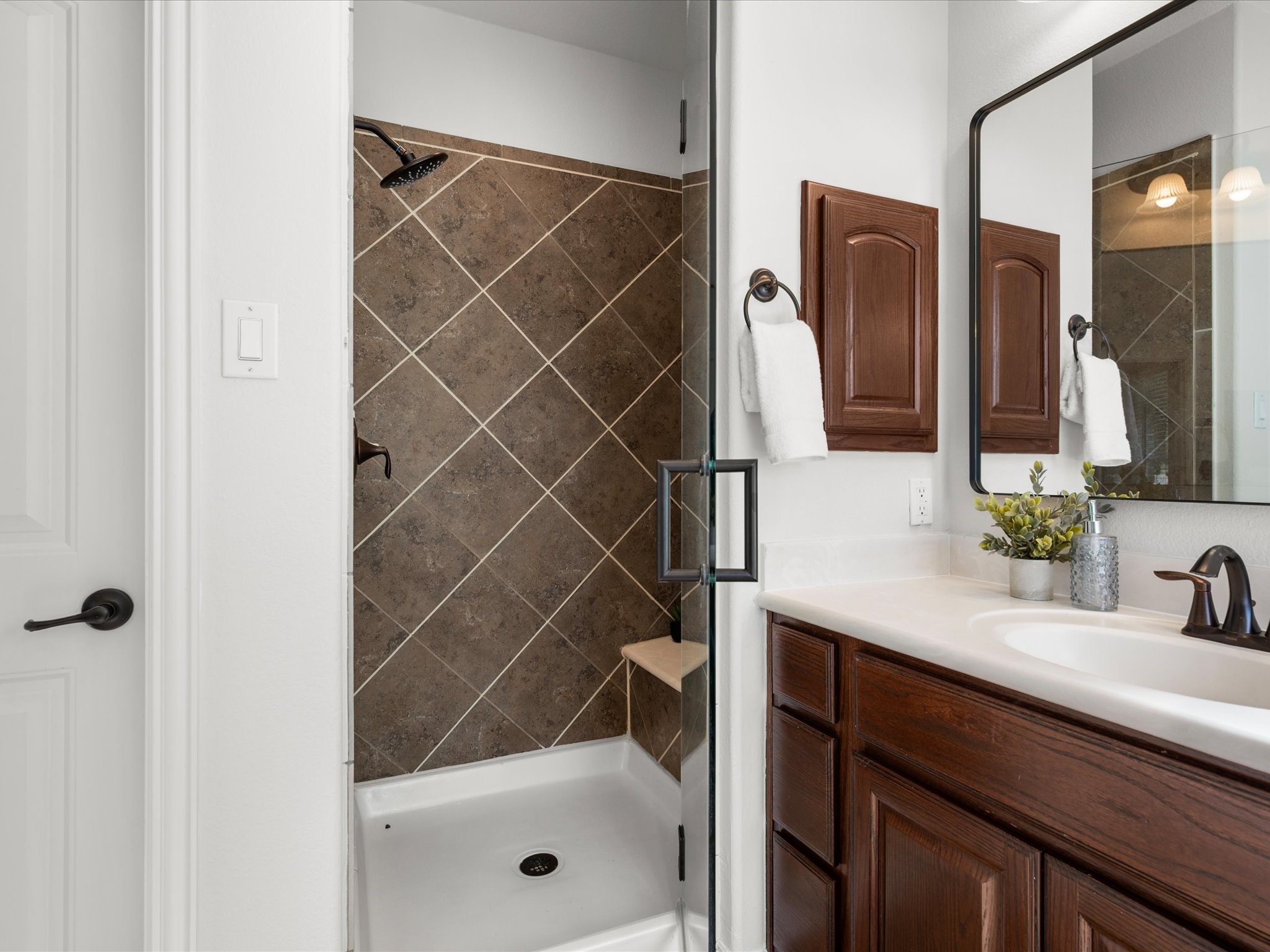323 Arbor Ridge Lane Conroe, TX 77384 - Photo 23 of 40 Walk-in shower, tons of counter space, and finishes that feel pulled together.
