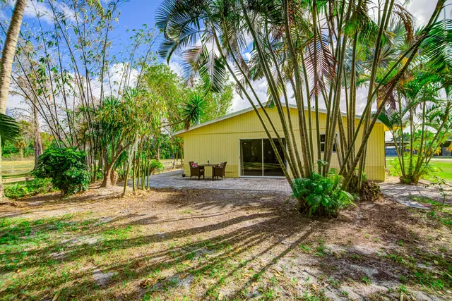 a backyard of a house with seating space