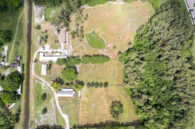 aerial view of a residential apartment building with a yard
