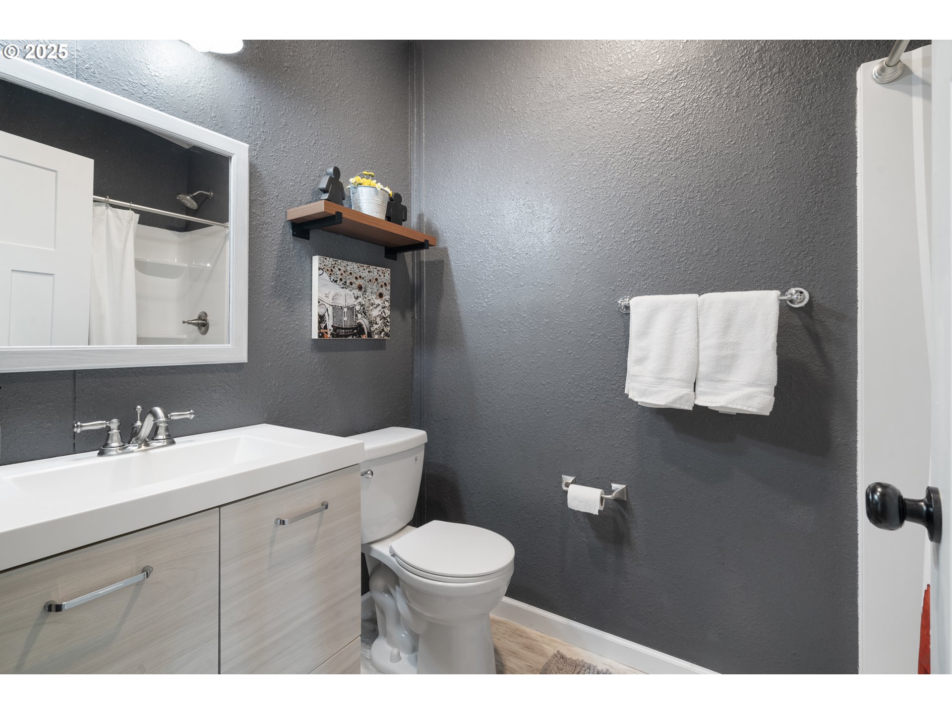 30402 Townsend Road Lebanon, OR 97355 - Photo 12 of 46 a bathroom with a toilet sink vanity and mirror