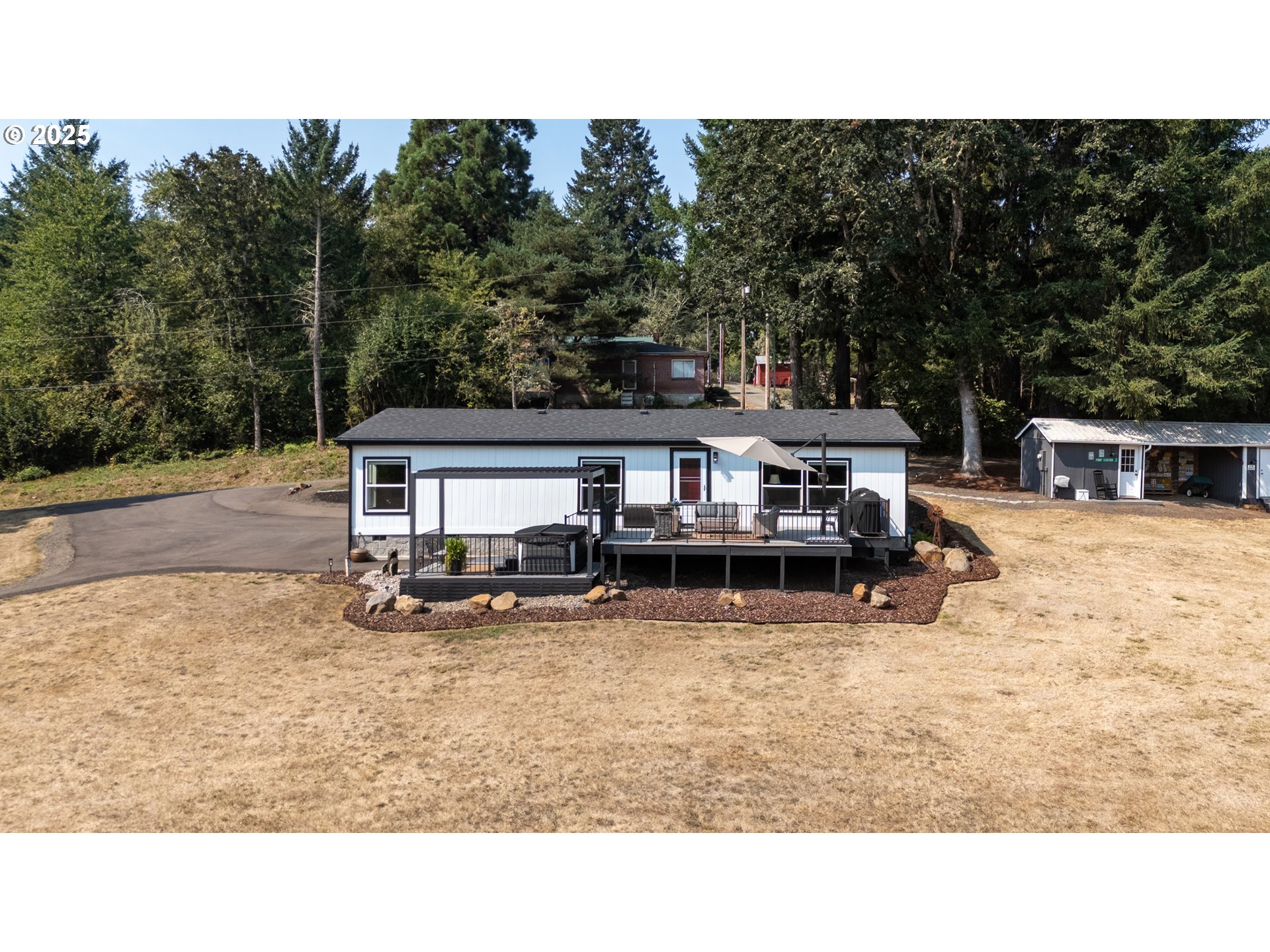 30402 Townsend Road Lebanon, OR 97355 - Photo 2 of 46 a view of a house with a big yard