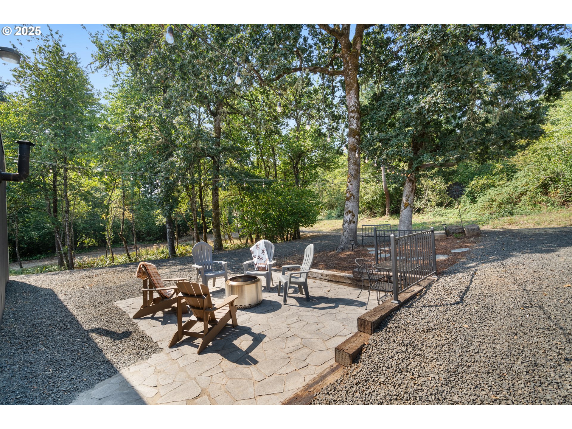 30402 Townsend Road Lebanon, OR 97355 - Photo 34 of 46 a view of a patio with table and chairs and potted plants with large tree