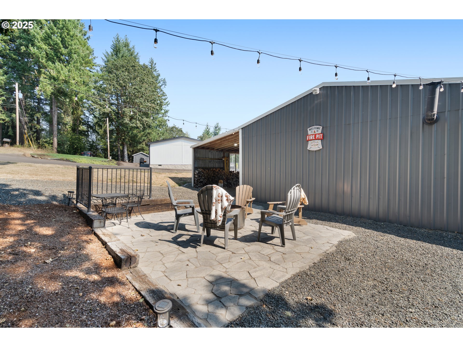 30402 Townsend Road Lebanon, OR 97355 - Photo 35 of 46 a view of a patio with table and chairs and couches with wooden fence