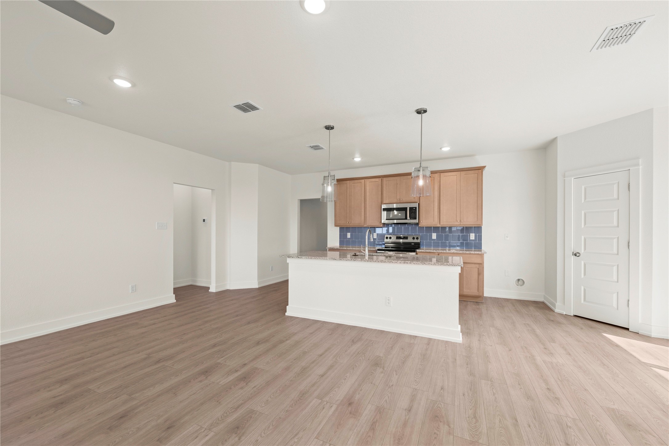 544 Gus Loop Georgetown, TX 78626 - Photo 6 of 22 a room with wooden floors and white walls