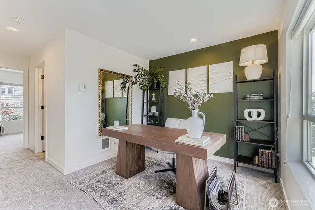 a workspace with furniture and window