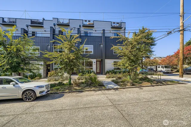 a view of a car parked in front of a building