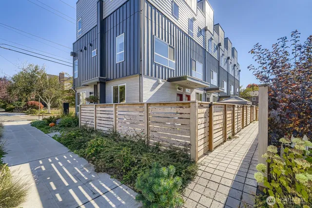 a view of a house with brick walls