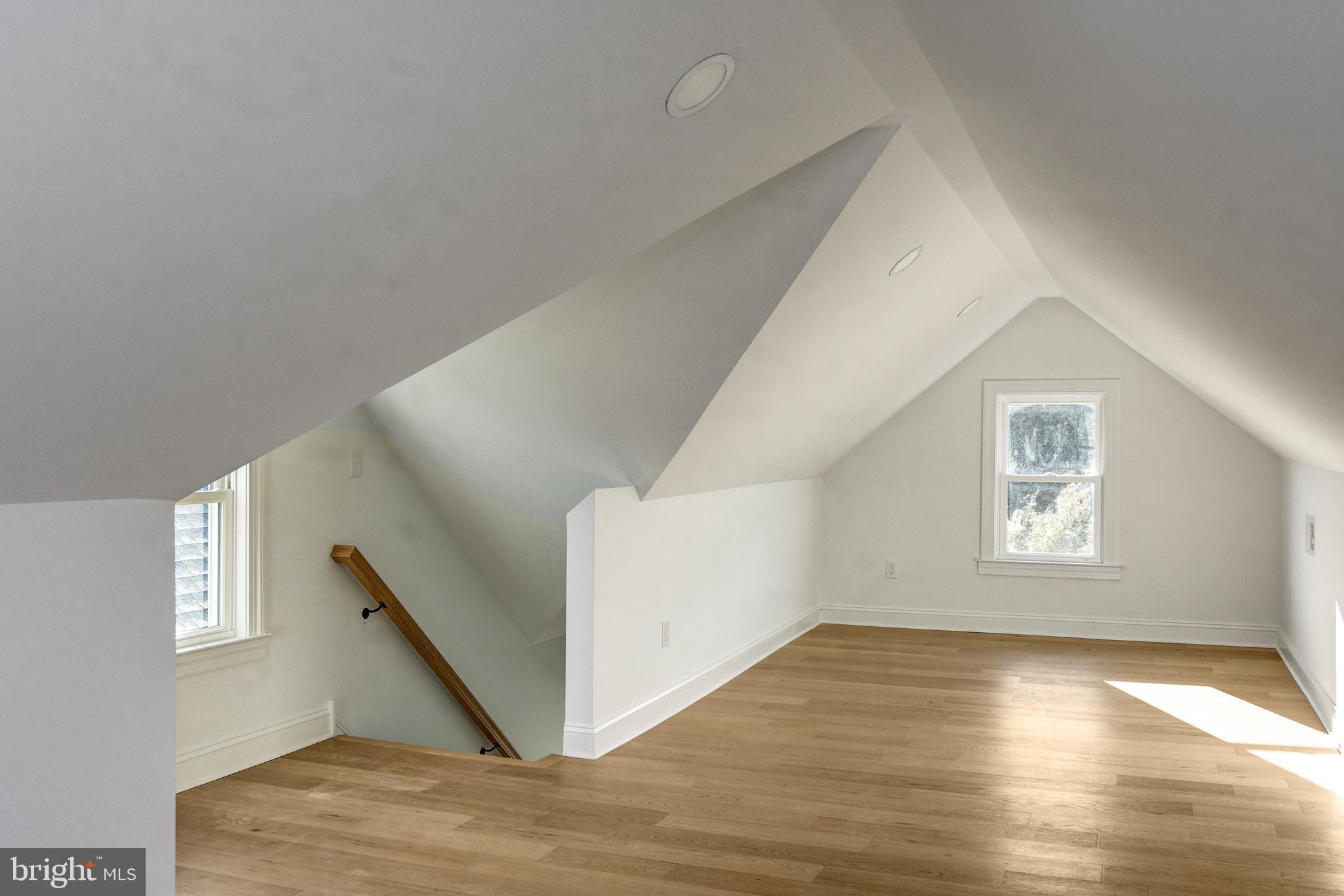13 Wilkins Avenue Haddonfield, NJ 08033 - Photo 18 of 20 a view of an empty room with wooden floor and a window