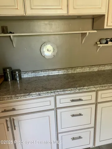 a room with a cabinets and window