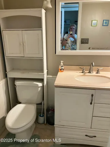 a kitchen with stainless steel appliances a stove a refrigerator and cabinets