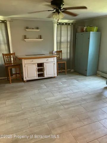 a living room with furniture window and wooden floor