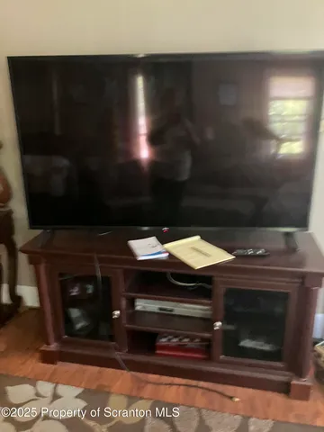 a workspace with furniture and a floor to ceiling window