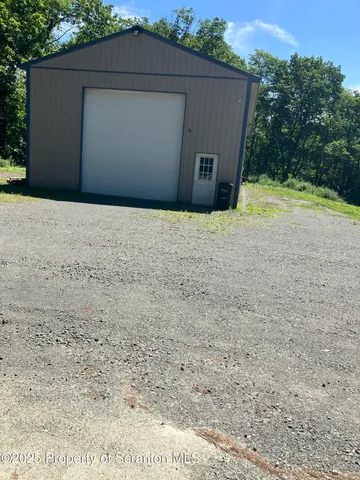 a view of a backyard with green space