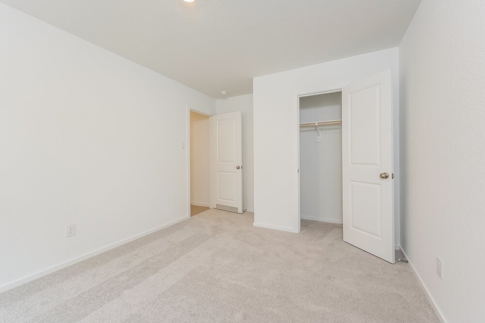 1527 Sunset Ridge Drive Conroe, TX 77306 - Photo 13 of 16 a view of an empty room